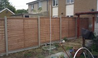 lapped panels & concrete posts & gravel boards